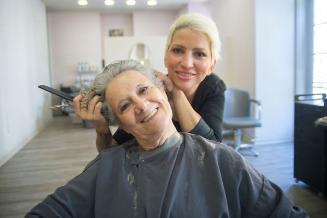 Stylist and client laughing